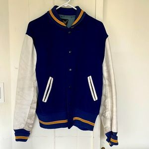 Blue, gold collar trim, white leather sleeve, varsity jacket